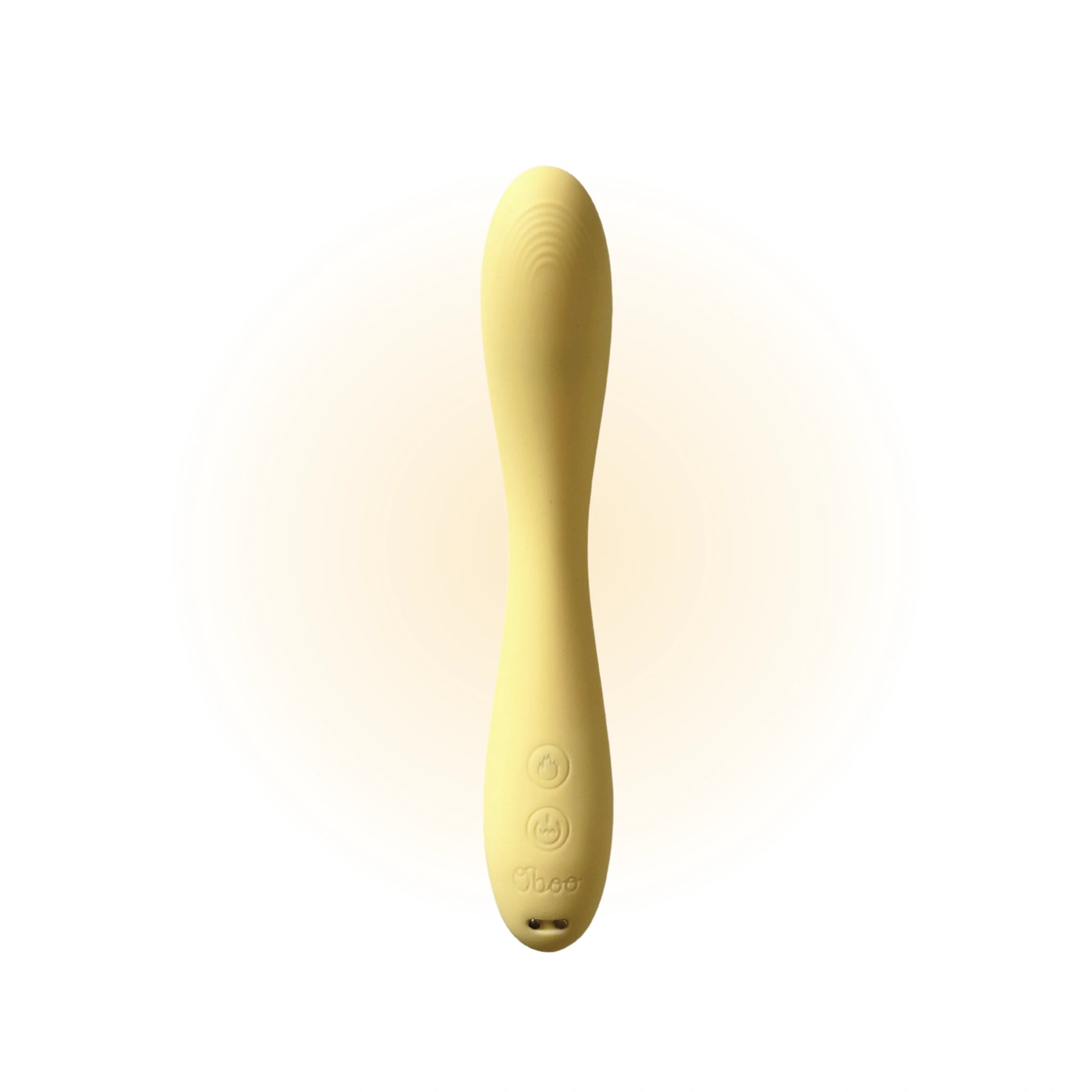 Yellow wand massager standing upright against a clean white background, showcasing its smooth texture and rounded design details.
