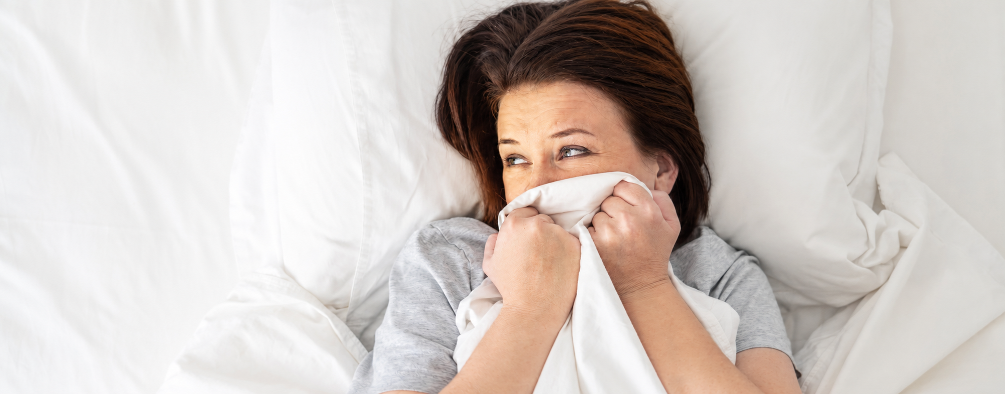 Midlife woman finding relief from pain during sex after menopause with Oboo wellness products