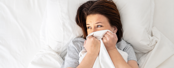 Midlife woman finding relief from pain during sex after menopause with Oboo wellness products
