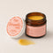 Open jar of Oboo Smooth Daily Vulva Balm with a melty golden swatch beside it — 100 percent natural and organic moisturizer for daily midlife comfort