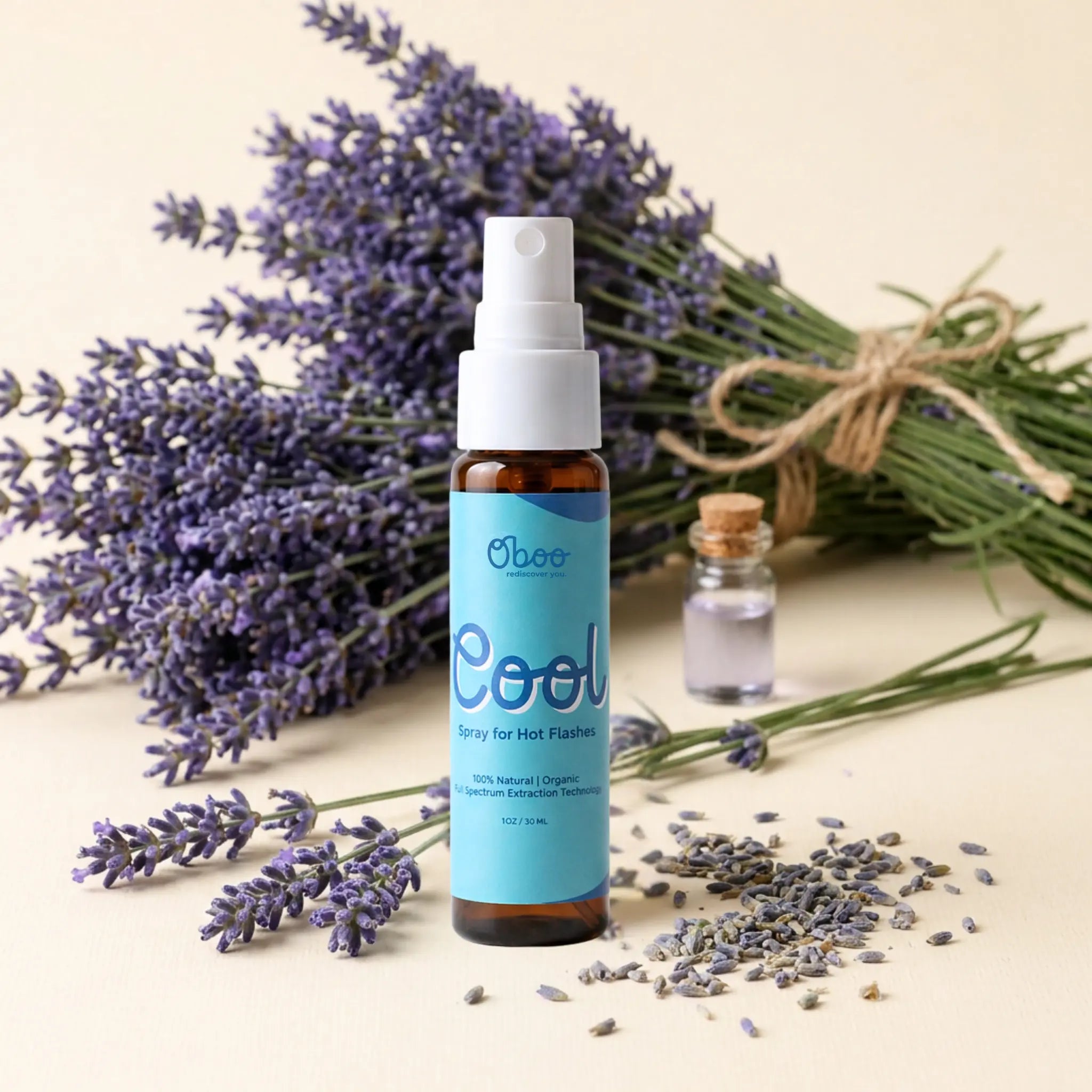 Oboo Cool Spray for Hot Flashes beside fresh lavender bunches and a small bottle of essential oil — 100 percent natural, plant-based menopause relief