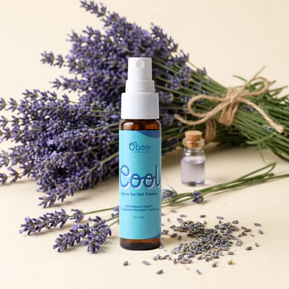 Oboo Cool Spray for Hot Flashes beside fresh lavender bunches and a small bottle of essential oil — 100 percent natural, plant-based menopause relief