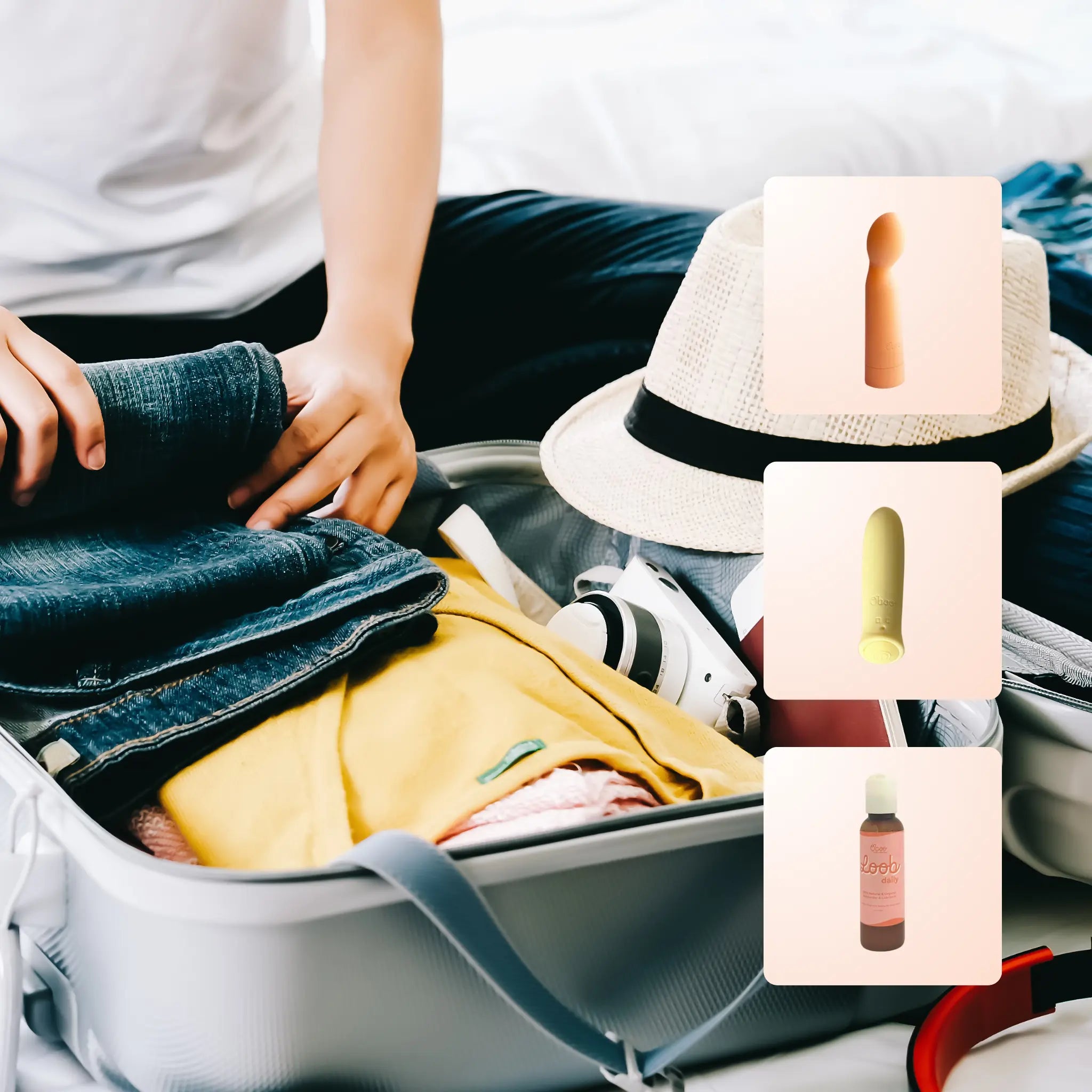 Open suitcase being packed with denim, a sun hat, and a camera, with the Oboo To Go essentials shown alongside — peach Oooh massager, yellow Woo bullet, and Loob Daily — your discreet travel pleasure kit