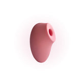 A close-up image of a pink, oval-shaped silicone stimulator with a rounded opening, shown against a white background.