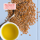 Spoonful of flax seeds beside a white cup of golden oil, emphasizing flaxseed oil’s inflammation-reducing benefits.