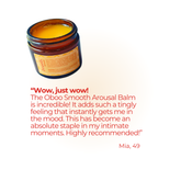 Open jar of Oboo Smooth Arousal Balm with a testimonial from a 49-year-old woman calling it an intimate staple.