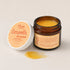 Open jar of Oboo Smooth Arousal Vulva Balm with a golden swatch — feel the tingle, an organic blend made to gently awaken your body