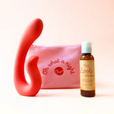 A red dual-action massager, pink “Oh what a night” pouch, and Oboo Loob Arousal bottle displayed against a peach background.