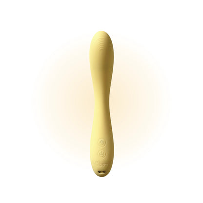 Yellow wand massager standing upright against a clean white background, showcasing its smooth texture and rounded design details.