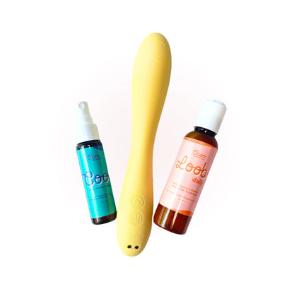 Cooch to Oh My core trio — Cool Spray for Hot Flashes, yellow Woosh Warming Wand, and Loob Daily Moisturizer on a soft pink background