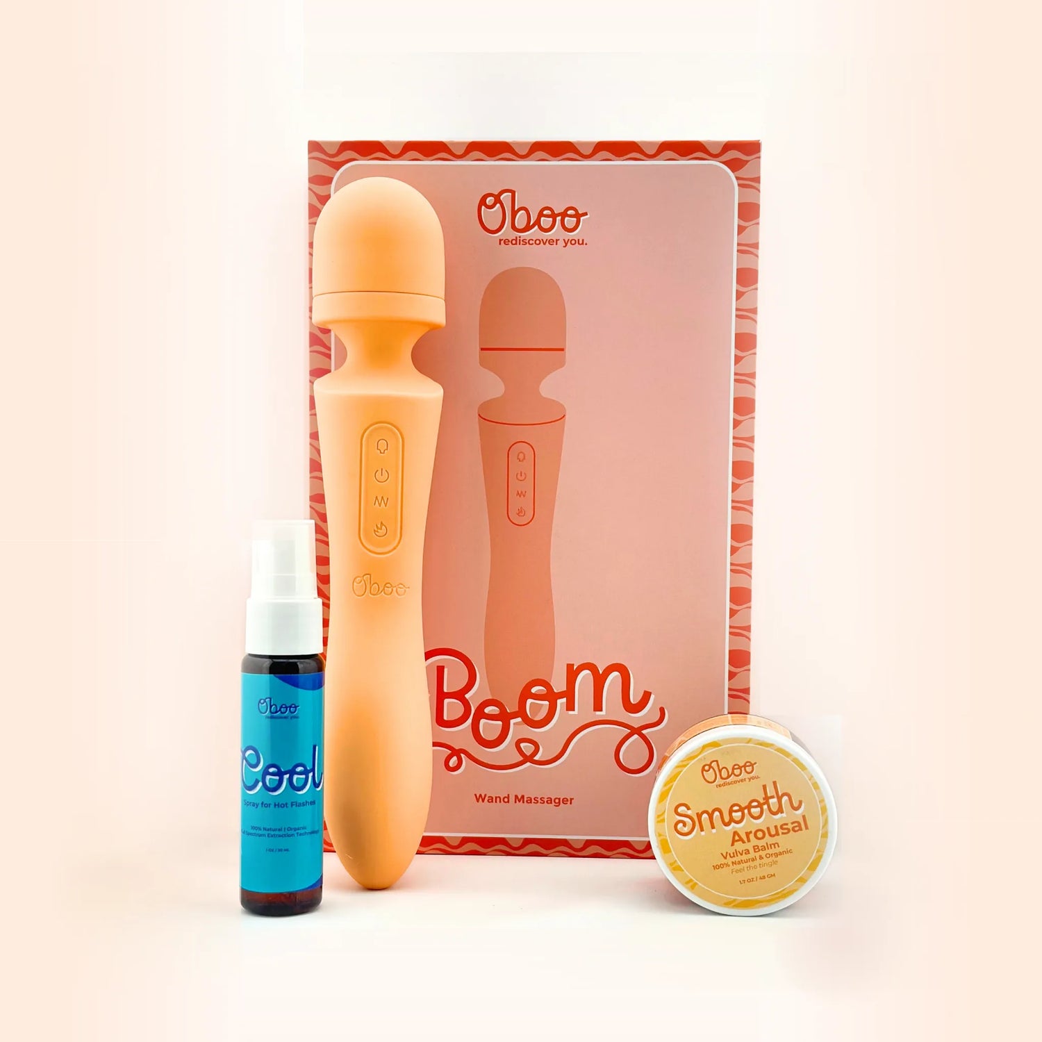 Goodnight Gorgeous Sleep and Pleasure Kit by Oboo — peach Boom Dual-End Wand with its product box, Cool Spray for hot flashes, and Smooth Arousal Vulva Balm jar